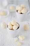 Coconut truffles in a white cup