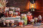 Various jars of preserved mushrooms and vegetables