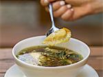 Clear broth with momos (dumplings from Nepal)