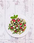 Courgette and feta cheese salad with raspberries (seen from above)