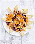 Salad with chicory, oranges, beetroot, smoked mackerel and walnuts