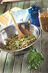 Bulgur salad with basil in a metal bowl