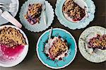 Portions of blueberry pie on plates