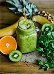 Green fruit smoothie with kiwi and parsley