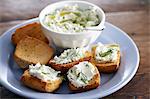Grilled bread with a herb and cream cheese spread