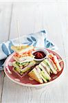 Club sandwiches with mackerel and vegetables