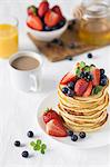 A stack of pancakes with fresh berries (USA)