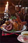 Capon with red wine pears