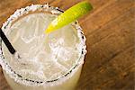 Margarita in a glass with a slice of lime and a salt-coated rim