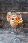 Chia pudding with bananas and nectarines in stemmed glasses