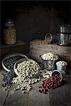 Assorted types of beans in containers