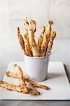 Savoury puff pastry straws in a mini bucket