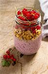 A breakfast jar with yoghurt, cheia seeds and redcurrants