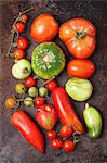 Assorted types of organic tomatoes (seen from above)