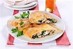 Mezzaluna con spinaci (Italian pastry pockets with a spinach filling)