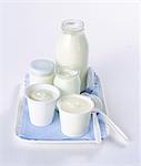 Yoghurt in assorted glasses and cups