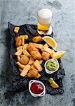 Fish and chips with avocado cream and ketchup