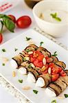 Aubergine rolls with ricotta, tomatoes and pine nuts