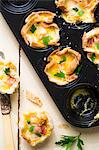 Toast quiches (slices of toast baked in a cupcake tin and filled with ham, egg and cheese)