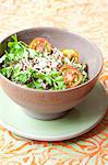 Quinoa salad with colourful tomatoes, spring onions and parsley