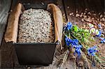 Healthy unbaked wholemeal bread in a loaf tin