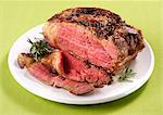 Sliced roast beef with rosemary