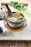 Asian miso soup with raw vegetables and coriander