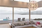 Modern luxury home showcase interior living room with chandelier and ocean view