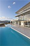 Tranquil modern luxury home showcase exterior infinity pool