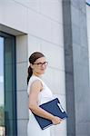 Businesswoman with agenda smiling at camera