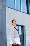 Business woman holding a computer