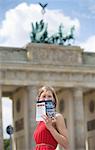 Pretty blonde woman doing sightseeing in Berlin