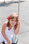 Cute girl in park on swing