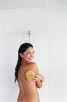 Pretty brunette woman enjoying a shower