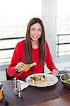 Woman eating at home