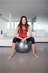 Woman with an excercise ball at home