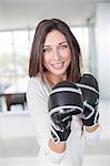 Woman with Boxing gloves at home