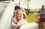 Portrait smiling mother and daughter in car