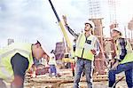 Construction workers talking at construction site