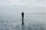 Middle aged man standing on a beach at Seabrook, Washington, USA.