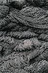 Close up of a pile of tangled up commercial fishing nets.