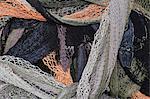 Close up of a pile of tangled up commercial fishing nets.