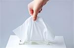 A hand seizing tissue