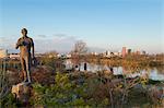 Riverfront and Russell W. Peterson Wildlife Refuge on the Christina River, Wilmington, Delaware, (Statue is Russell Peterson).