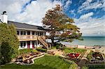 Daytime exterior of Lake Huron Inn overlooking the beach, Huron House B&B, Oscoda, MI.