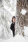 Boy and tree in the snow