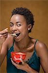 Woman eating bowl of cereal