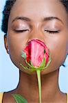 Woman smelling roses