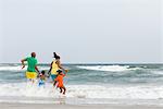 Family jumping in the sea