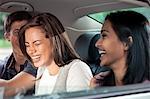 Teenagers riding in car